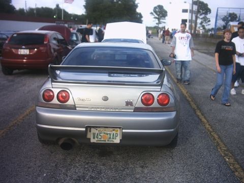 1991 Ford Probe - R33 ass. Notice how he has the license plate jerry-rigged to fit J-spec tag mounts