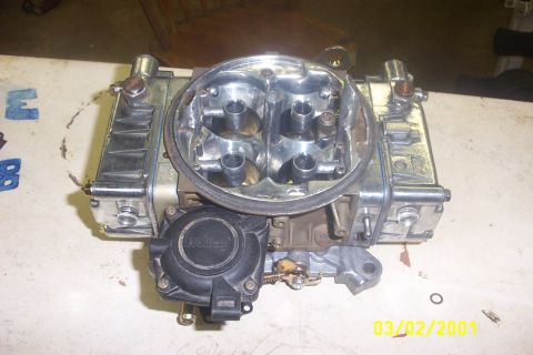 1979 Ford F-150 - A Holley carburetor is shown on a table, with a date stamp of 03/02/2001 in the corner.