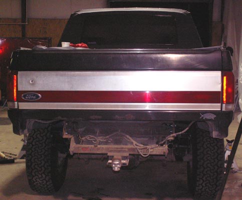 I've got a "Big Mike" rear bumper.   The Sky brackets are bolted on through the factory holes.  The size of the bracket means the bumper brackets are going to have to under go some significant grinding before the rear bumper can go back on.