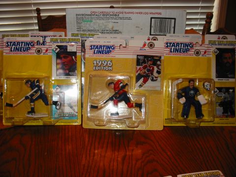 1991 Ford Bronco - Collection of Starting Lineup sports collectible hockey figures and cards from various years.