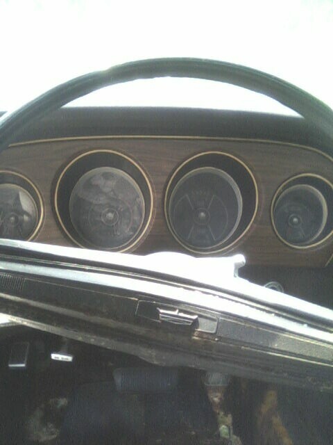 2001 Ford Taurus - Interior view of a car's dashboard, showing gauges and the steering wheel.