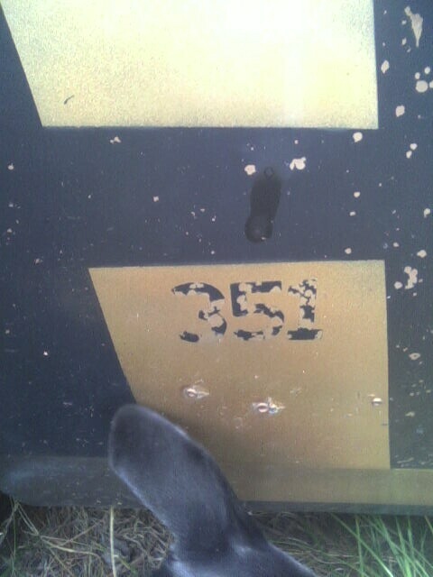 2001 Ford Taurus - Stenciled number 351 is visible on a dark surface with yellow rectangular markings.