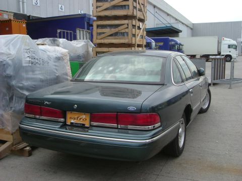 1996 Ford Crown Victoria - Rear view of a 1996 Ford Crown Victoria sedan parked in an industrial area.