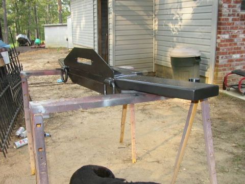 1995 Ford Bronco - A custom-fabricated bumper is shown mounted on sawhorses, likely awaiting installation or further work.