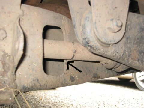 1991 Ford Explorer - Undercarriage view showing suspension parts, with a black arrow indicating a specific bracket.
