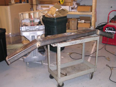 1996 Ford Bronco - A custom bumper is shown resting on a cart labeled 'Rhonda's Cart' in a workshop setting.