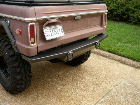 1995 Ford Bronco - This 1978 Ford Bronco features a custom rear bumper and a large off-road tire.