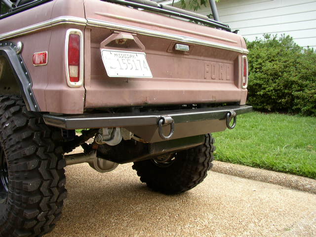 Rear view of a 1978 Ford Bronco with aftermarket bumper and large off-road tire