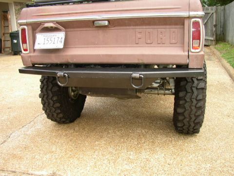 1995 Ford Bronco - This Ford truck features a heavy-duty aftermarket bumper and off-road tires, with a Mississippi license plate on the tailgate.