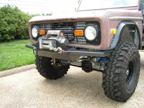 1995 Ford Bronco - This 1977 Ford Bronco features a winch and an aftermarket bumper, suggesting off-road modifications.
