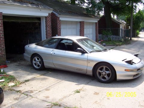 1993 Ford Probe - Silver 1993 Ford Probe GT coupe in a driveway, with a garage in the background.
