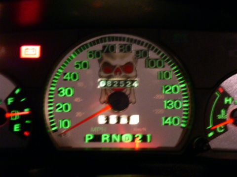 2001 Ford Crown Victoria - Dashboard gauges feature a skull decal and illuminated markings for speed and gear selection.