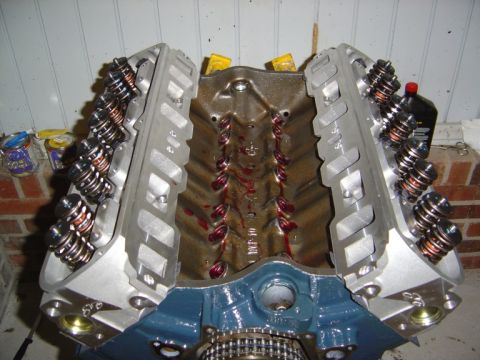 1986 Ford Bronco - Close-up view of an engine block and cylinder heads, with valve train components visible.