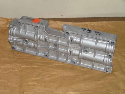 2000 Ford Excursion - Aluminum valve body with handwritten markings and a red circle with '22' written in it.