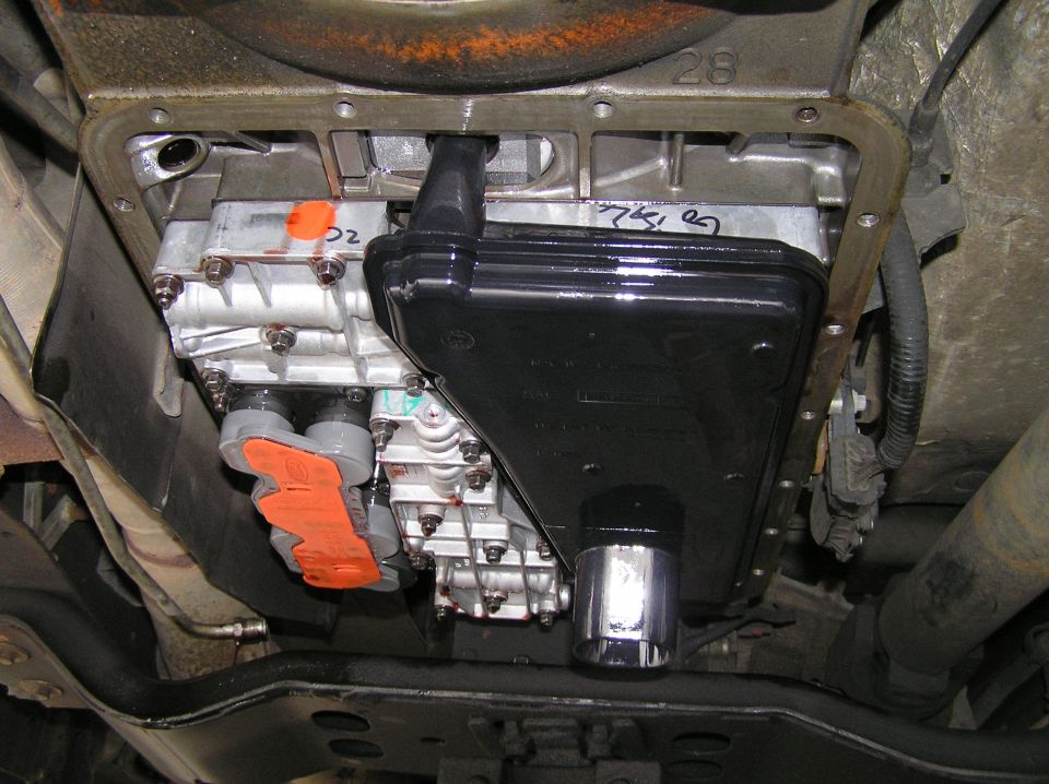 Transmission valve body and filter exposed with pan removed on Ford Excursion