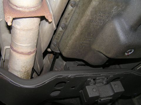 2000 Ford Excursion - Underside view of vehicle components, including exhaust and transmission pan.
