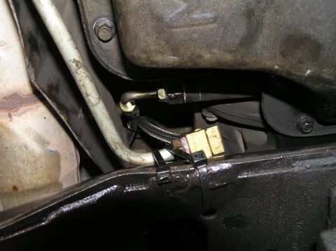2000 Ford Excursion - Transmission cooler line fitting with brass connector and zip ties.