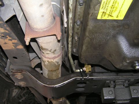 2000 Ford Excursion - Close-up of the transmission pan and exhaust system, showing a newly installed remote transmission filter.