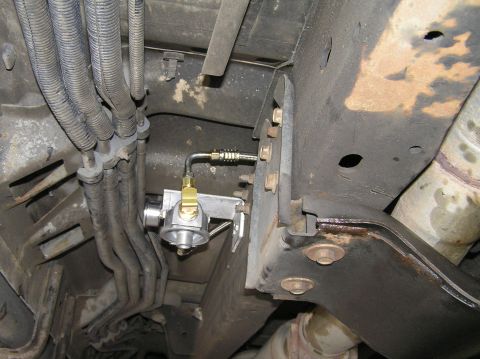 2000 Ford Excursion - Close-up view of the underbody of a 2000 Ford Excursion, highlighting a newly installed transmission filter.