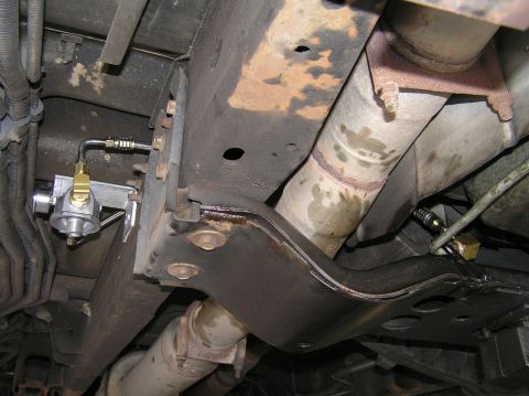 2000 Ford Excursion - Underside view of a 2000 Ford Excursion showing a remote transmission filter installation.