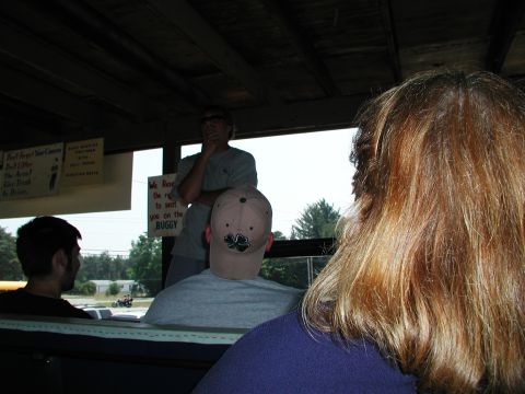 1992 Ford Taurus - View from inside a buggy with people and signs visible on the interior walls.