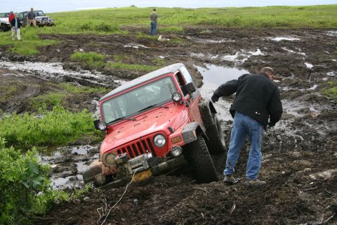 2003 Jeep TJ - Off-roading adventure goes wrong as a Jeep TJ gets stuck in thick mud.