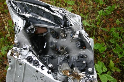 2003 Jeep TJ - This is a close-up of damaged electronic equipment, possibly from an aircraft, lying on the ground.