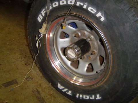 1979 Ford Bronco - Close-up of a tire and wheel assembly with visible tire brand and model information.