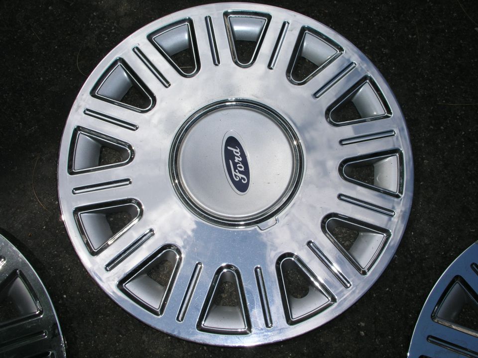 Chrome Ford wheel cover with blue oval logo