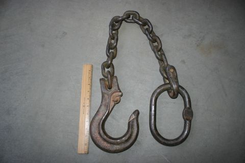 2003 Jeep TJ - A heavy-duty chain assembly with a hook and a shackle, next to a wooden ruler.