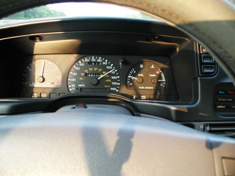1992 Ford Taurus - Interior view of a 1992 Ford Taurus dashboard, showing the instrument cluster and steering wheel.