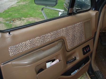 1991 Ford Bronco - Interior view of a car door panel with custom leopard print accents.