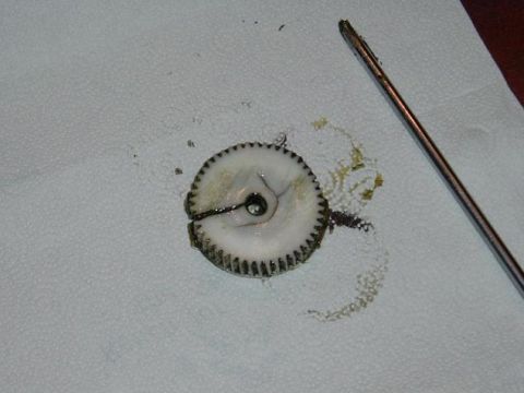 1991 Ford Bronco - A broken gear and a screwdriver are shown on a paper towel.
