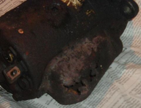 1991 Ford Bronco - A close-up view of a heavily used and corroded automotive starter motor.