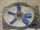 1988 Ford Bronco - Very small, low-resolution shot of a circular engine cooling fan with light-colored blades on a dark hub, seen head-on. Detail is too coars…