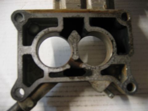 1985 Ford Crown Victoria LTD - Close-up view of a CFI throttle body, showing its internal structure and two intake ports.