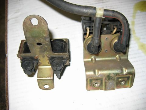 1985 Ford Crown Victoria LTD - Two vacuum solenoid valves mounted on metal brackets with hoses.