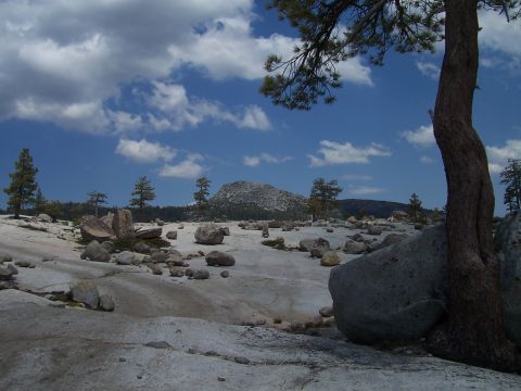 1998 Ford Ranger - A wide shot of a rocky, mountainous area under a partly cloudy sky.