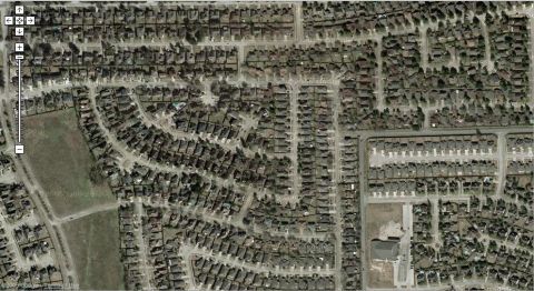2000 Ford Crown Victoria - This is an aerial photograph of a residential area, showing numerous houses and streets from an overhead perspective.