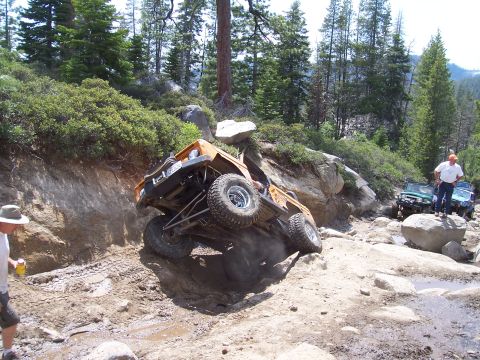 1998 Ford Ranger - Off-road vehicle tackling a challenging rocky trail with other vehicles waiting behind.