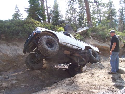1998 Ford Ranger - Pickup truck attempting a difficult climb on a , off-road trail.