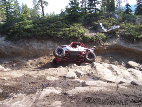 1998 Ford Ranger - This off-road buggy navigates a challenging rocky incline during an outdoor excursion.