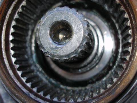 1995 Ford Bronco - A detailed view of a vehicle's hub assembly, showing the internal splines and central threaded opening.