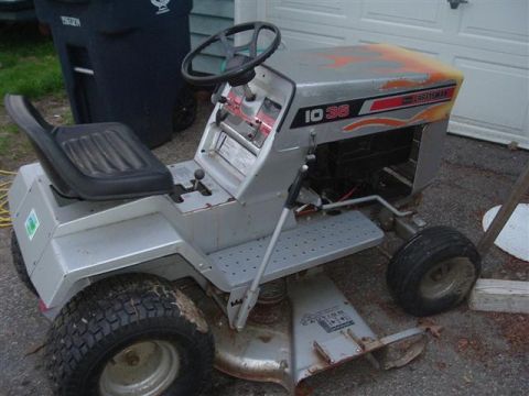 1966 Land Rover Discovery - Riding lawn mower with 'Craftsman 10 36' visible on the hood and flame decals.