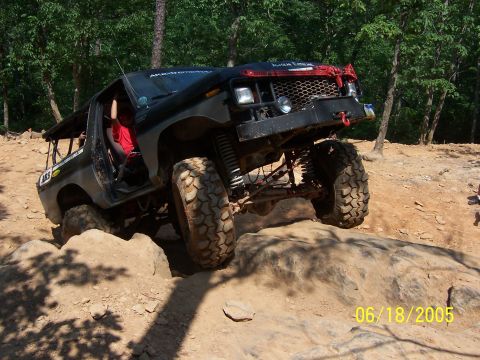 1978 Ford Bronco - This heavily modified SUV tackles a challenging rocky obstacle course on a sunny day.