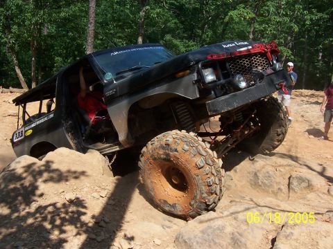 1978 Ford Bronco - This heavily modified 1978 Ford Bronco is navigating a challenging rock crawling course.