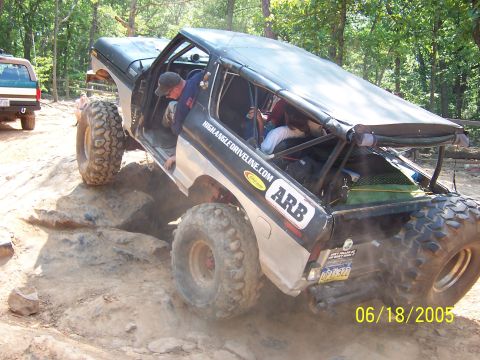 1978 Ford Bronco - A modified 1978 Ford Bronco navigates a rocky trail with a second vehicle visible in the background.