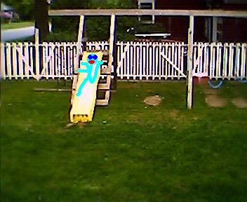 1966 Land Rover Discovery - A drawing of a stick figure is superimposed on a slide in a backyard scene.
