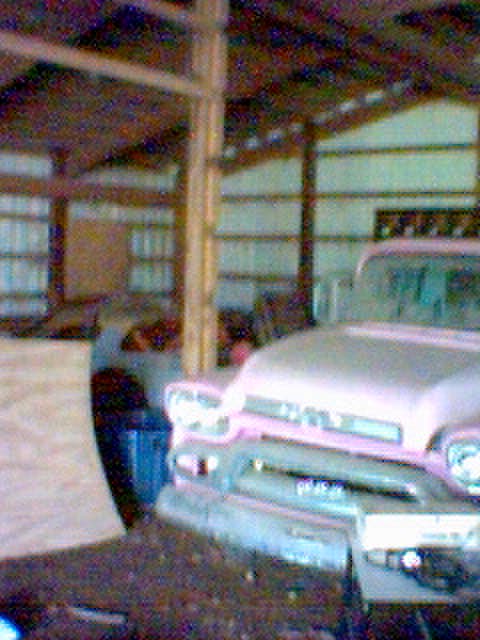 1994 Ford Bronco - This pink pickup truck appears to be from the mid-1950s, possibly a 1955 model.