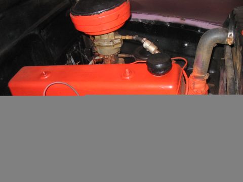 1986 Ford Bronco - Close-up view of an engine compartment, highlighting the valve covers and air intake system.